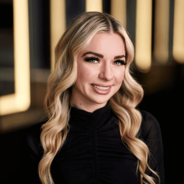 Portrait of Elodi, a professional stylist at Salon Bliss & Spa, showcasing their expertise and style.