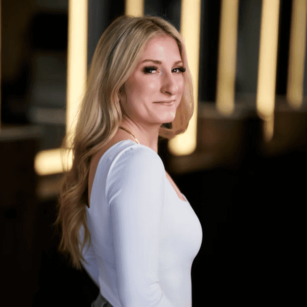 Portrait of Sam, a professional stylist at Salon Bliss & Spa, showcasing their expertise and style.