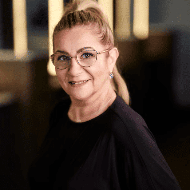 Portrait of Sabina, a professional stylist at Salon Bliss & Spa, showcasing their expertise and style.