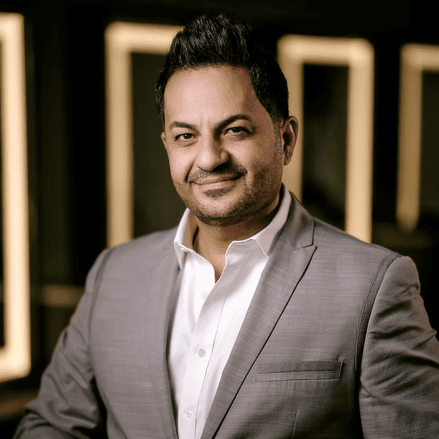 Portrait of Atheer, a professional stylist at Salon Bliss & Spa, showcasing their expertise and style.