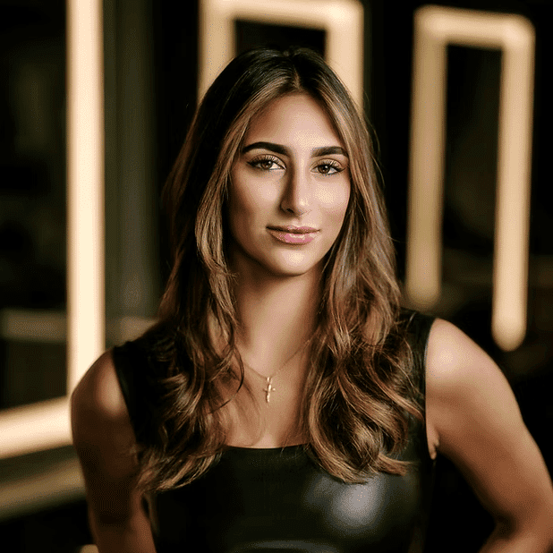 Portrait of Nina T., a professional stylist at Salon Bliss & Spa, showcasing their expertise and style.