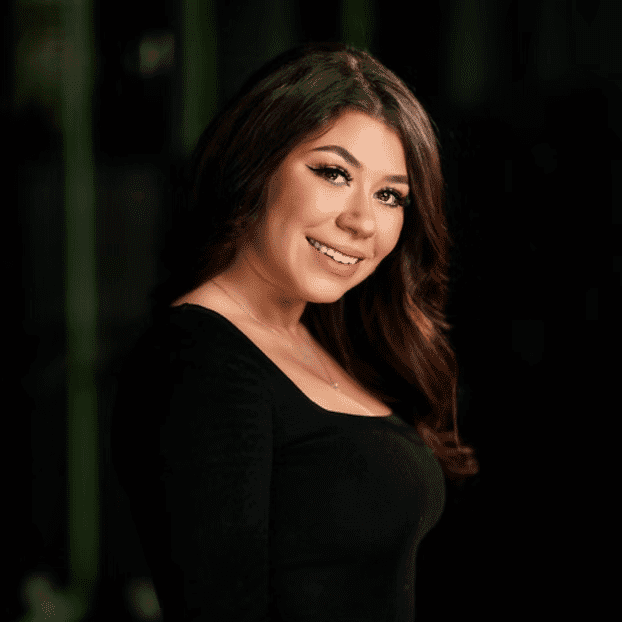 Portrait of Giusy, a professional stylist at Salon Bliss & Spa, showcasing their expertise and style.