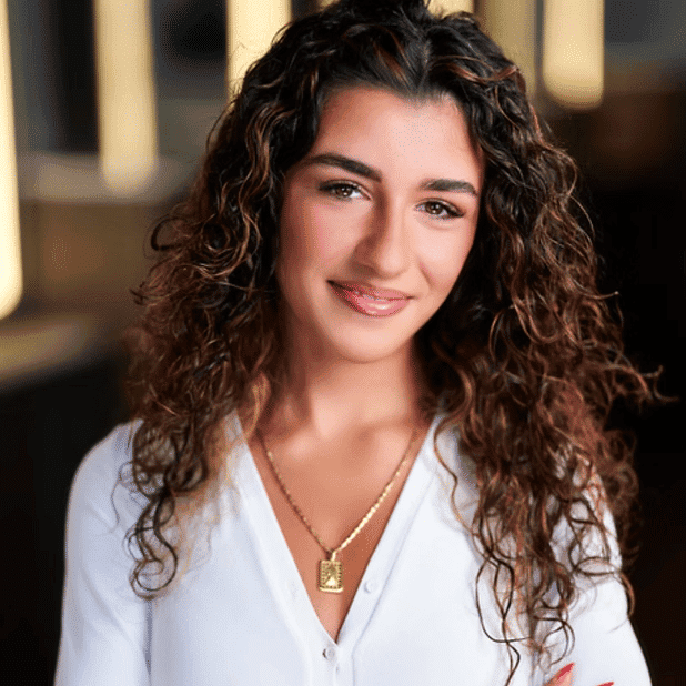 Portrait of Gina, a professional stylist at Salon Bliss & Spa, showcasing their expertise and style.